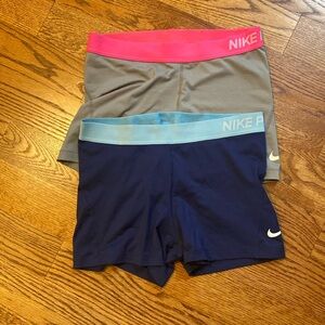 Two pairs of Nike Pro spandex shorts